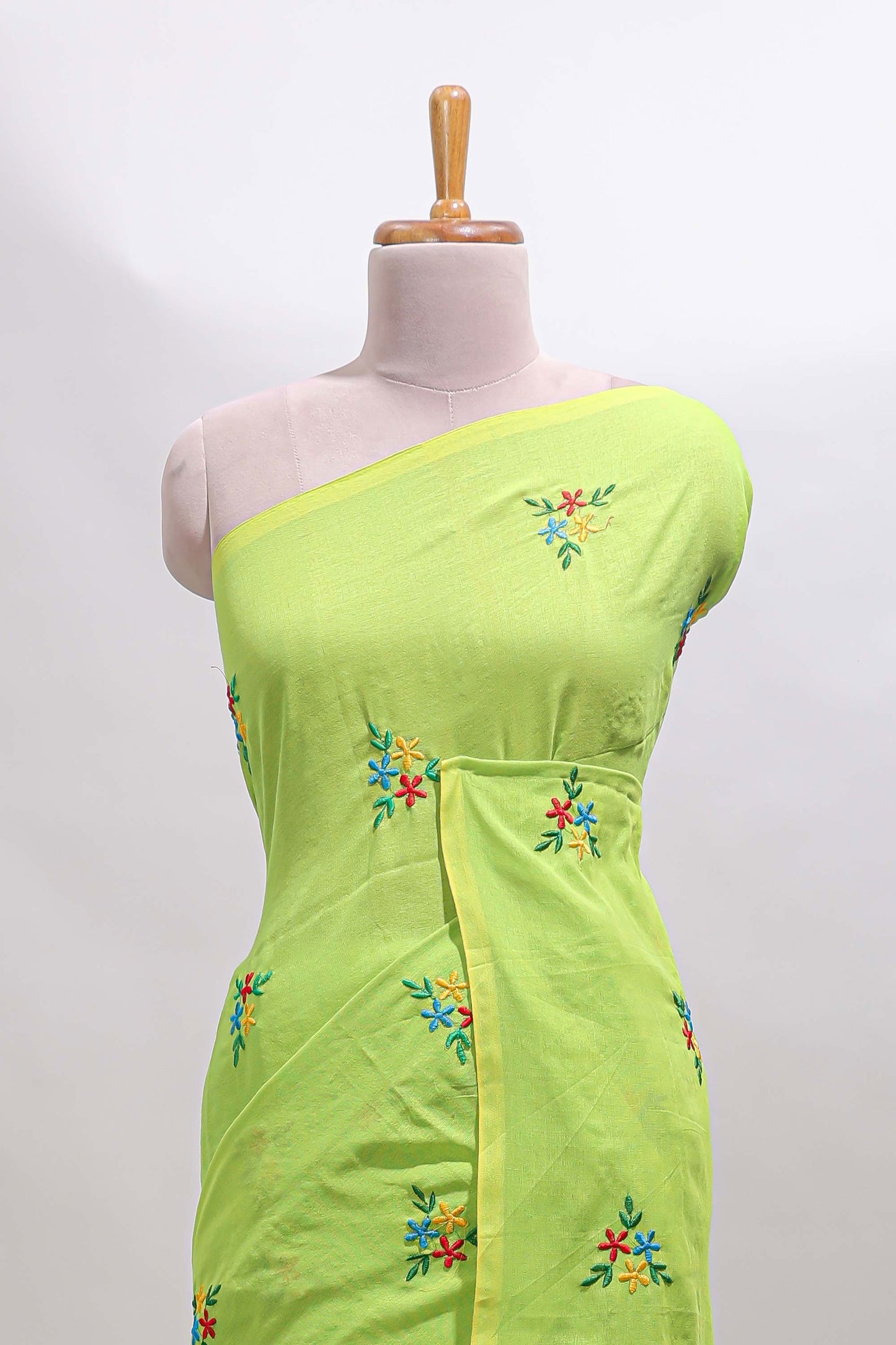 Green floral motifs south cotton sarees with self border and contrast printed blouse