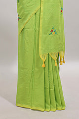 Green floral motifs south cotton sarees with self border and contrast printed blouse