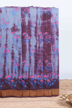 Pale blue with brown floral design shibori print sungudi cotton saree with contrast zari bentex border and pallu
