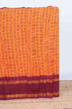 Orange tamil script print sungudi cotton saree with contrast zari bentex border and pallu