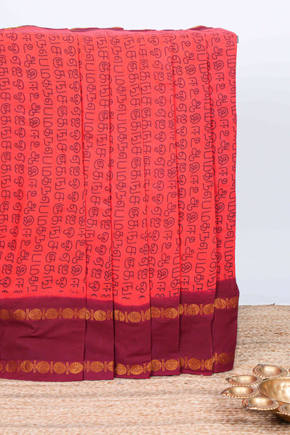 Pink tamil script print sungudi cotton saree with contrast zari bentex border and pallu