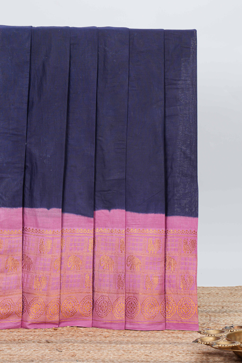 Elegant navy blue Sungudi cotton saree with contrast temple inspired pattern border and contrast pallu along with matching blouse