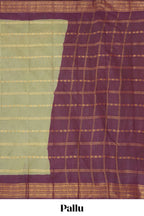 Pastel green Sungudi cotton saree with gold zari stripe motifs a contrasting  zari border checked pallu and contrast blouse