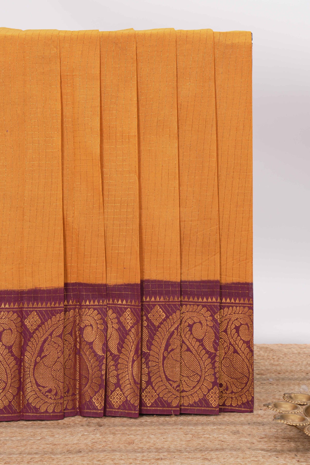 Mustard yellow Sungadi cotton saree with checked body contrasting  peacock zari border striped pallu and a matching checked blouse