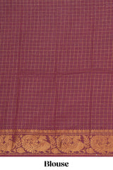 Mustard yellow Chettinad cotton saree with checked body contrastingpeacock zari border striped pallu and a matching checked blouse