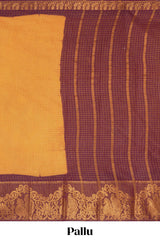 Deep Mustard yellow Chettinad cotton saree with checked body contrasting peacock zari border striped pallu and a matching checked blouse