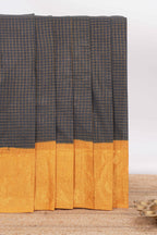 Black sungudi cotton saree with checked body contrasting peacock zari border striped pallu and a matching checked blouse