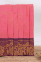 Pink sungudi cotton saree with checked body contrasting peacock zari border striped pallu and a matching checked blouse