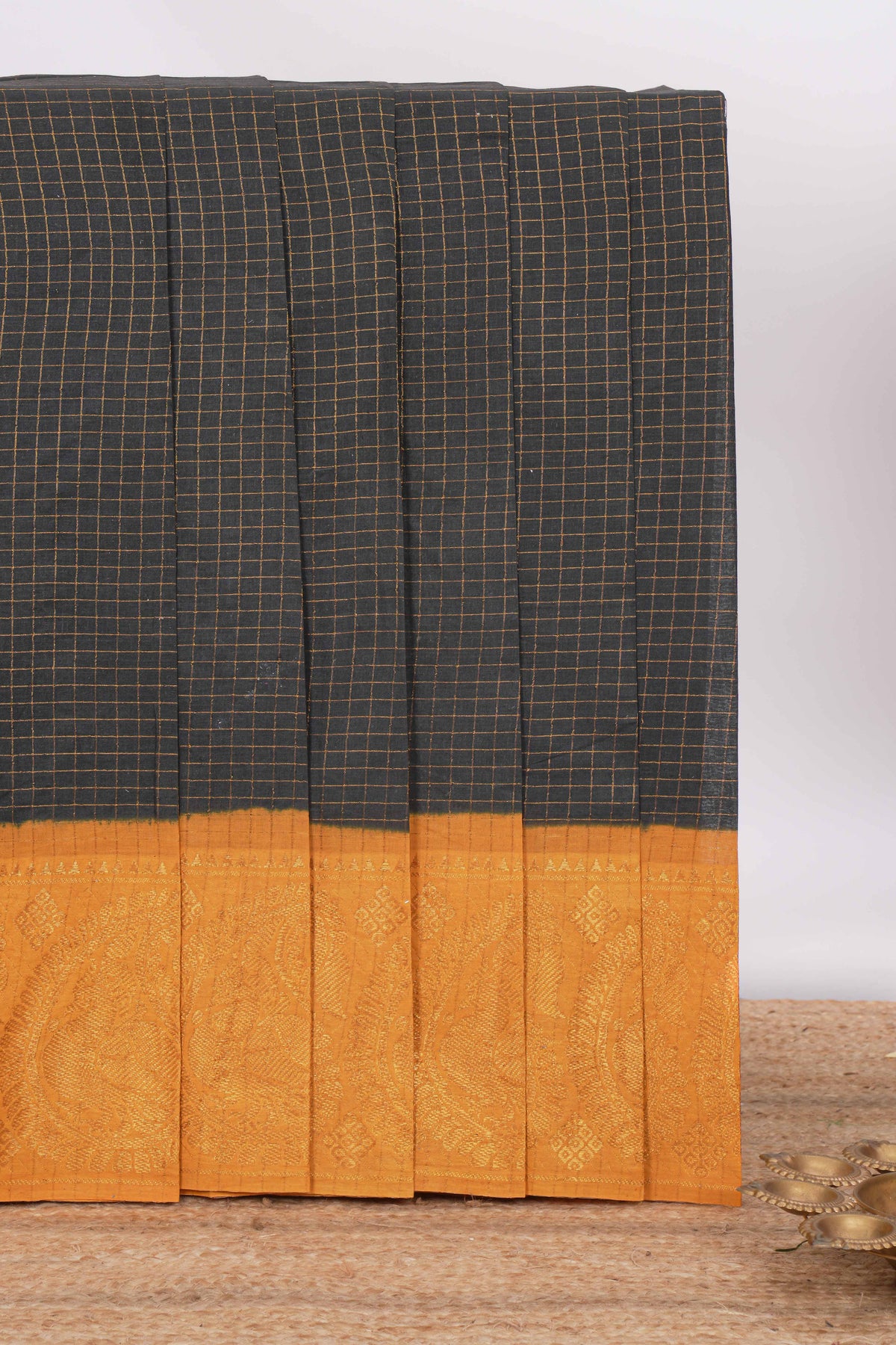 Jet black Sungadi cotton saree with checked body contrasting peacock zari border striped pallu and a matching checked blouse