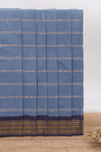 Indigo Blue Sungudi cotton saree with gold zari stripe motifs a contrasting  zari border checked pallu and contrast blouse