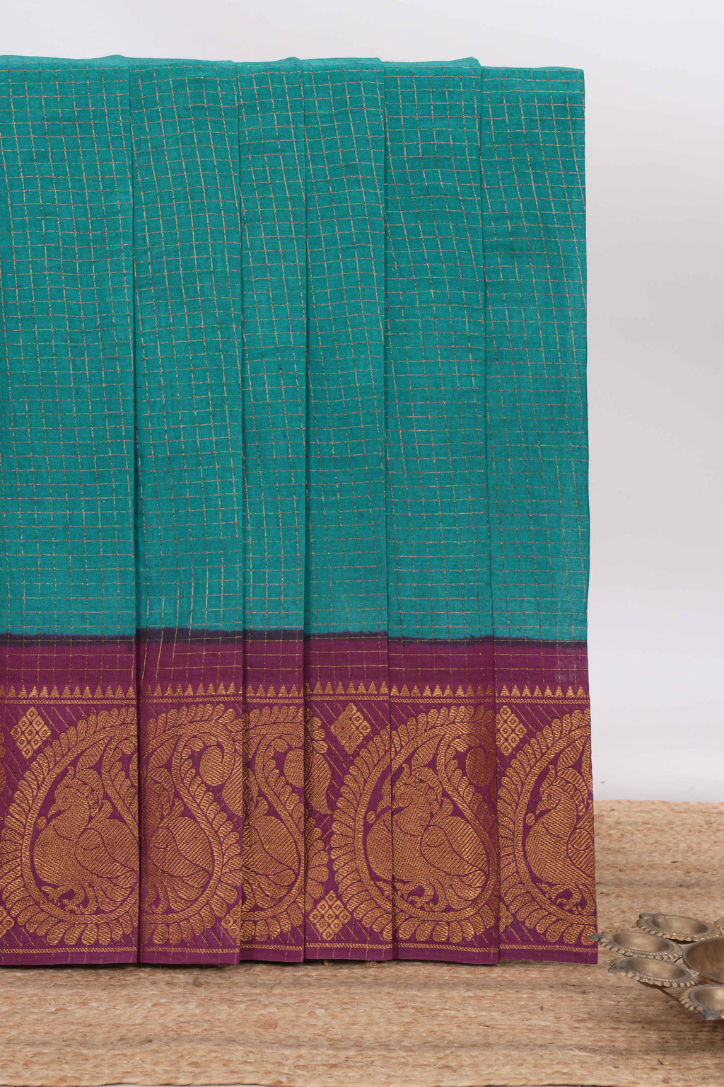 Bottle green Sungadi cotton saree with checked body contrasting peacock zari border striped pallu and blouse