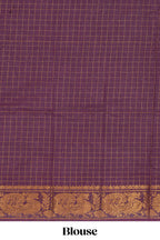 Bright pink sungudi cotton saree with checked body contrasting peacock zari border striped pallu and blouse