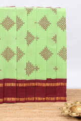 Parrot green traditional kolam print sungudi cotton saree with contrast border and striped pallu