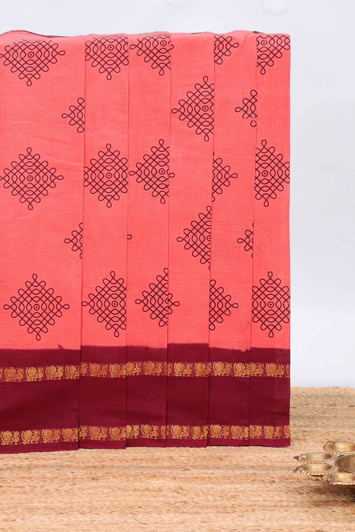 Pink traditional kolam print sungudi cotton saree with contrast border and striped pallu