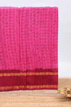 Pink tamil letters print sungudi cotton saree with contrast border and striped pallu