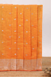 Bright orange butta designed silk cotton saree with self zari border and blouse