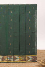 Dark green butta designed silk cotton saree with self zari border and contrast blouse
