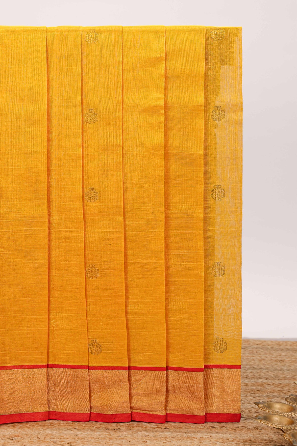 Yellow butta designed silk cotton saree with contrast zari border and blouse