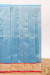 Light blue butta designed silk cotton saree with contrast zari border and blouse