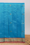 Blue butta designed silk cotton saree with contrast zari border and blouse