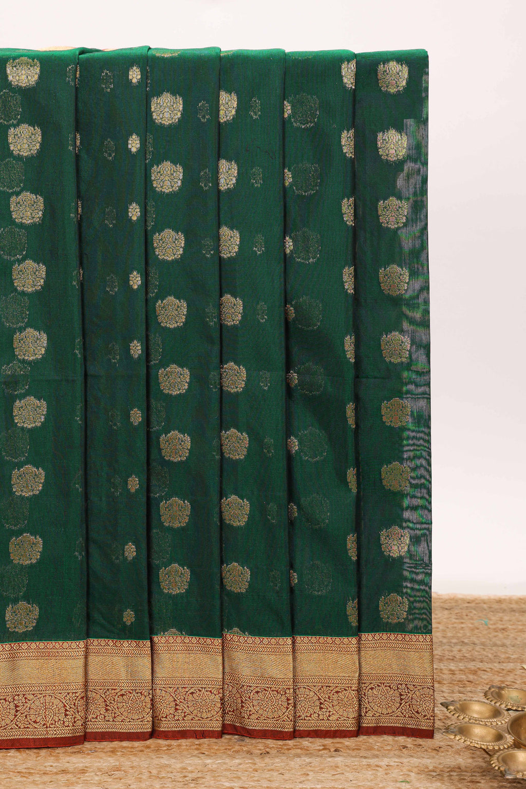 Dark green butta designed silk cotton saree with contrast zari border and blouse