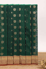 Dark green butta designed silk cotton saree with contrast zari border and blouse