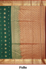 Dark green butta designed silk cotton saree with contrast zari border and blouse