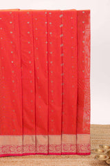 Coral red butta designed silk cotton saree with self zari border and contrast blouse