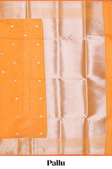 Bright orange butta designed silk cotton saree with self zari border and matching blouse