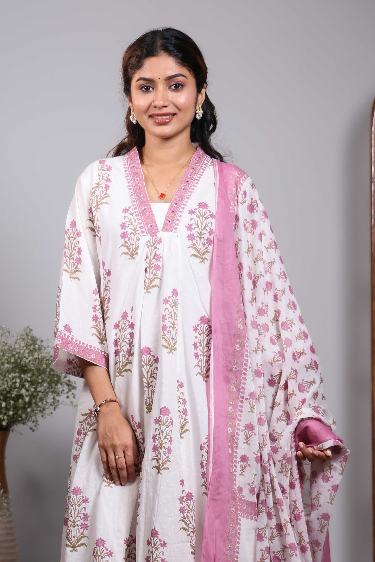 Cream floral design V neck salwar set with 3/4th sleeve, contrast bottom and matching dupatta