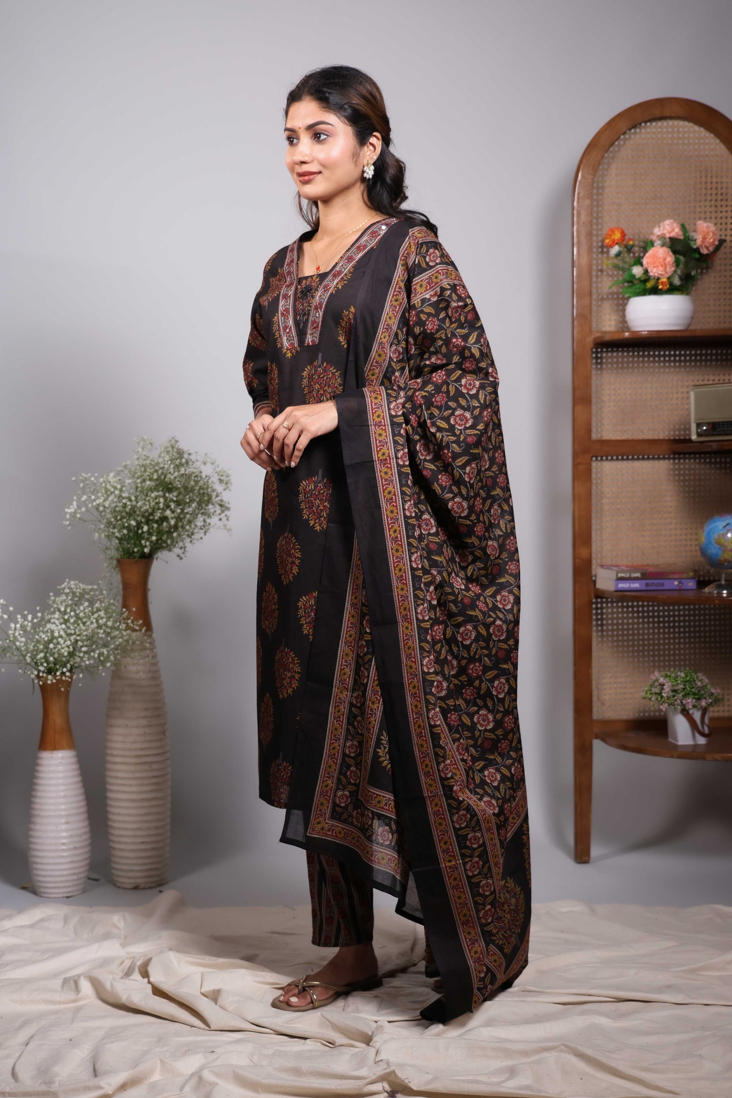 Black floral motifs design V neck salwar set with 3/4th sleeve, self bottom and matching dupatta