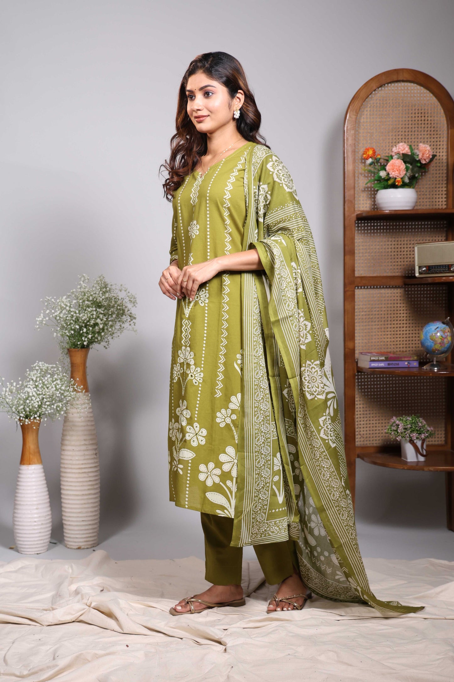 Green striped floral motifs design V neck salwar set with 3/4th sleeve, self bottom and matching dupatta
