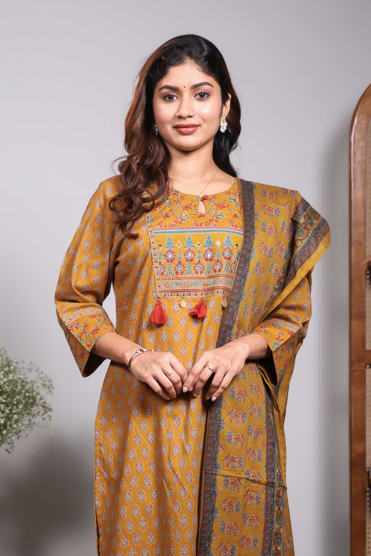 Mustard floral motifs design round neck salwar set with 3/4th sleeve, self bottom and matching dupatta