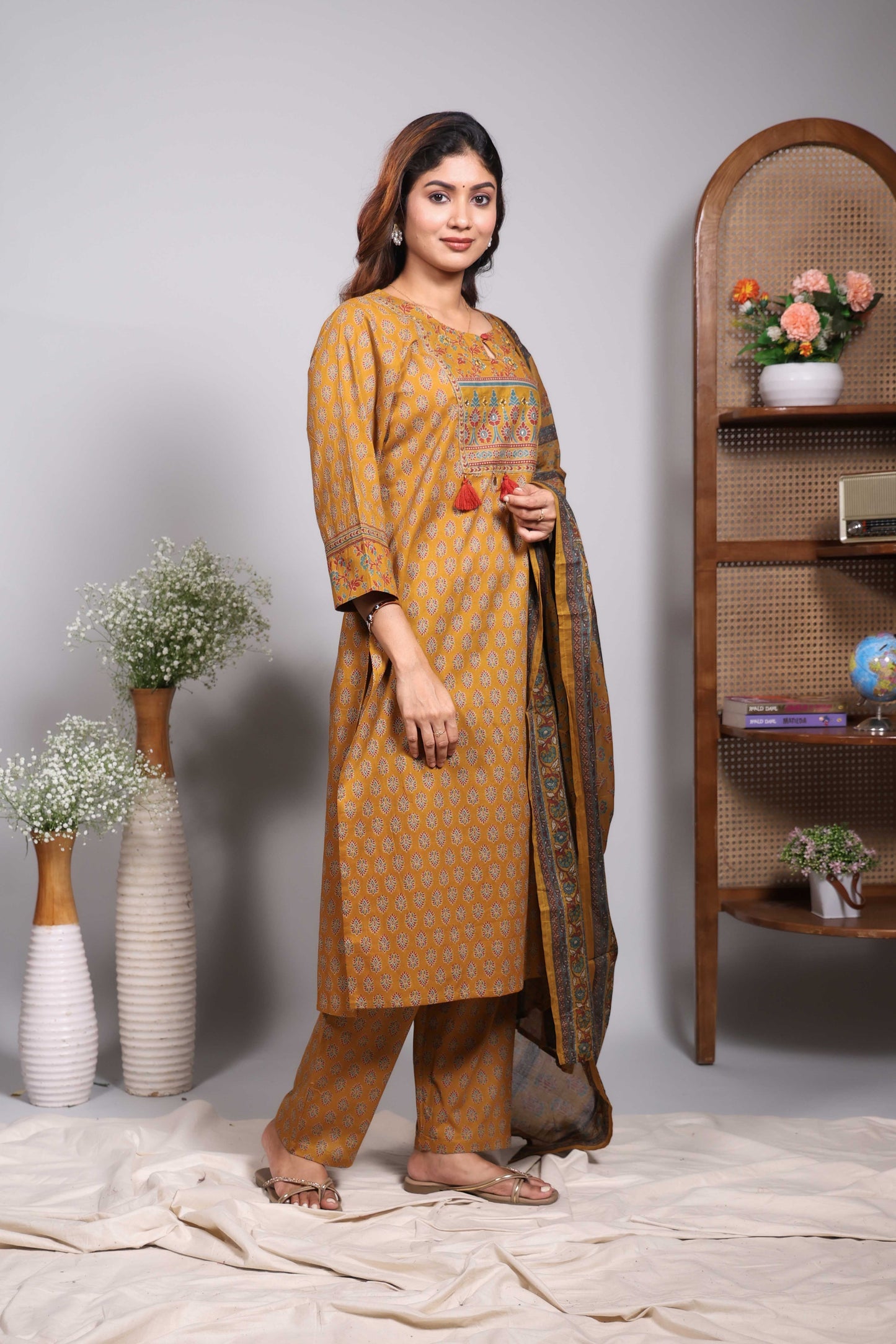 Mustard floral motifs design round neck salwar set with 3/4th sleeve, self bottom and matching dupatta
