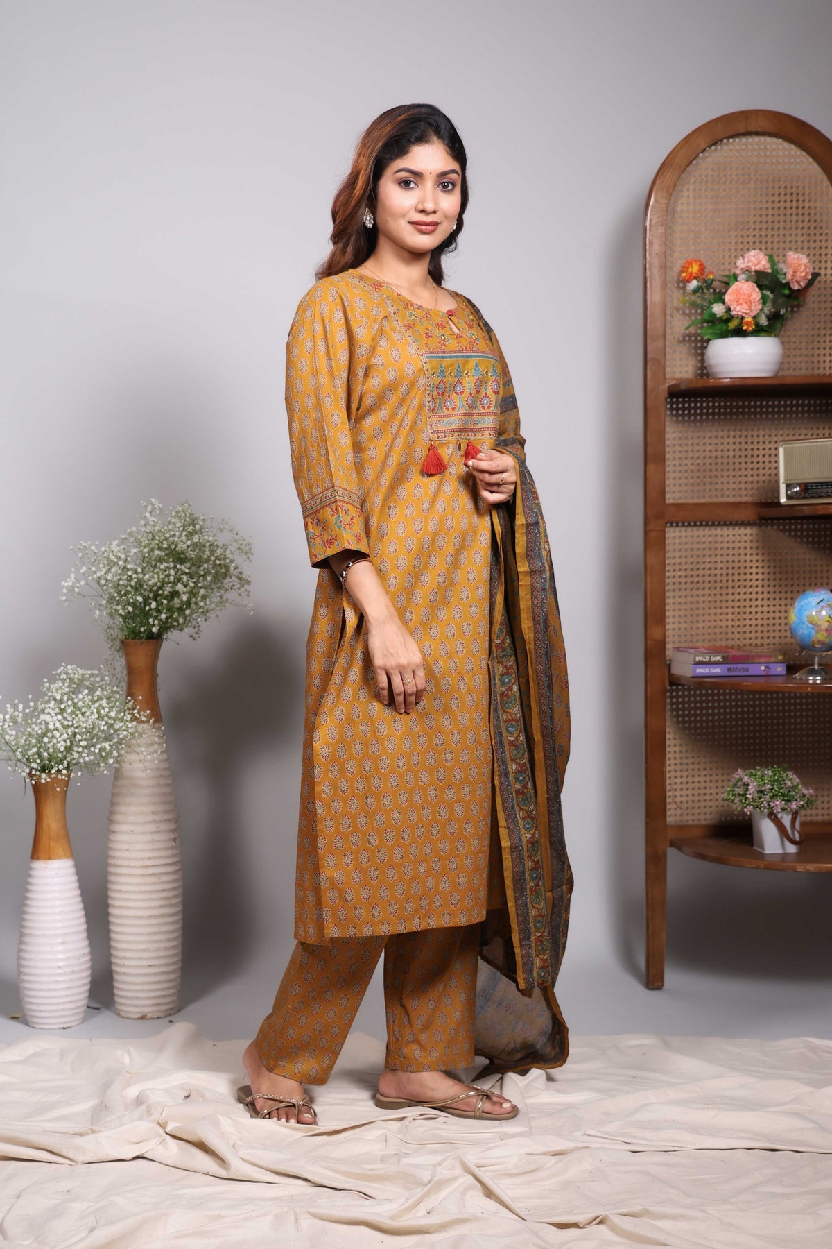 Mustard floral motifs design round neck salwar set with 3/4th sleeve, self bottom and matching dupatta