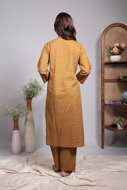 Mustard floral motifs design round neck salwar set with 3/4th sleeve, self bottom and matching dupatta