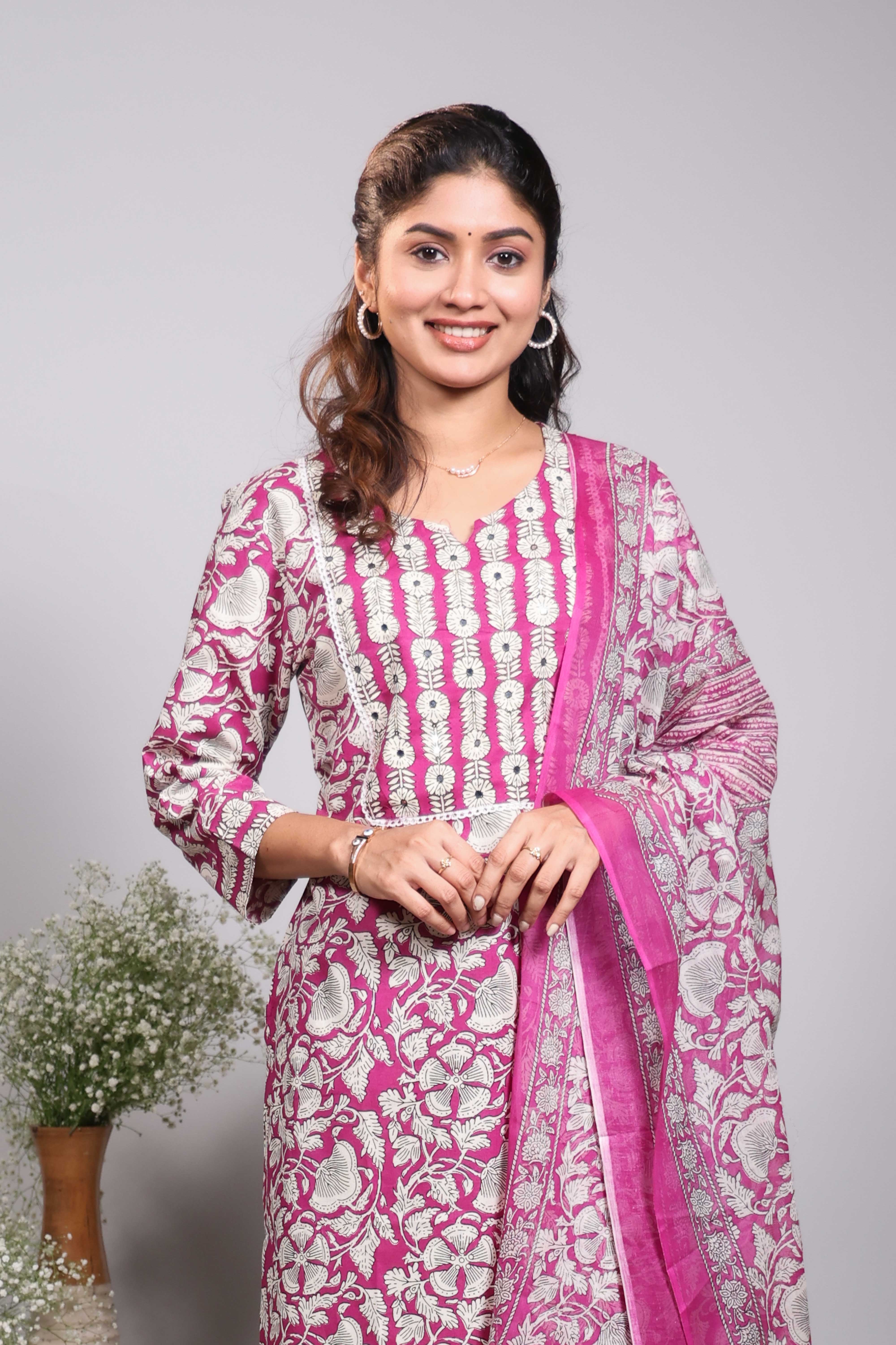 Pink floral design round neck salwar set with 3/4th sleeve, self bottom and matching dupatta