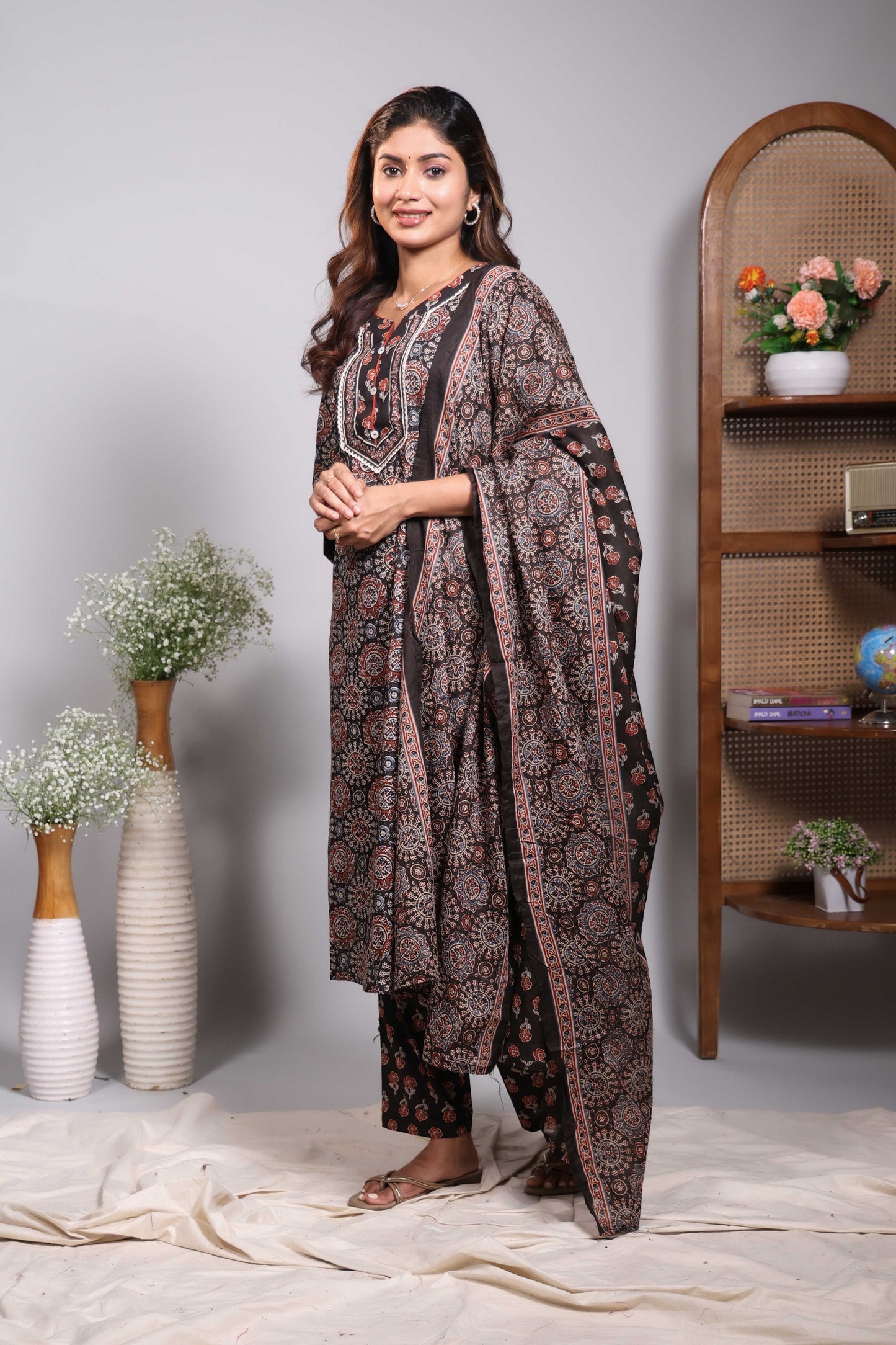 Black floral design round neck salwar set with 3/4th sleeve, self bottom and matching dupatta