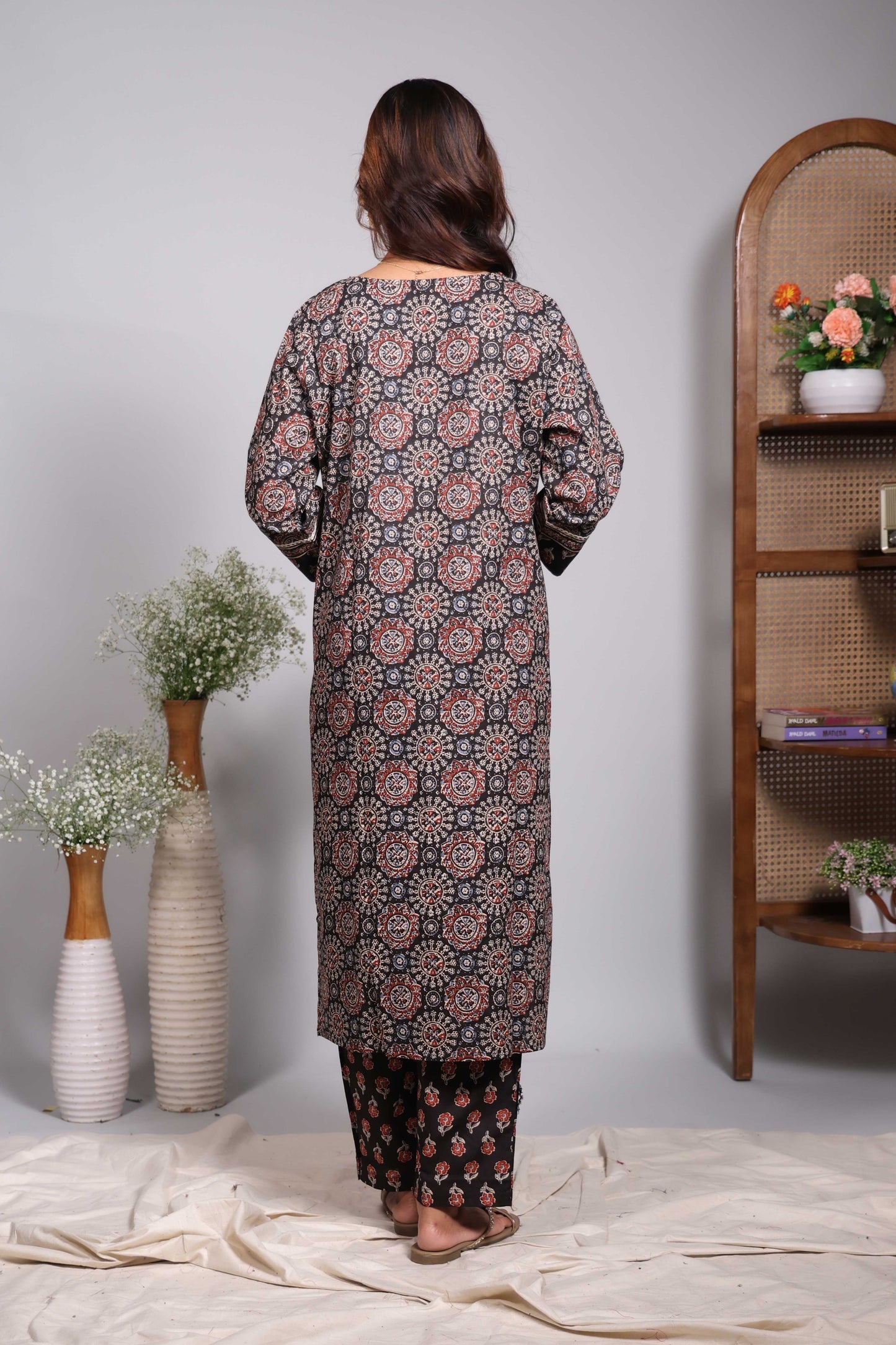 Black floral design round neck salwar set with 3/4th sleeve, self bottom and matching dupatta