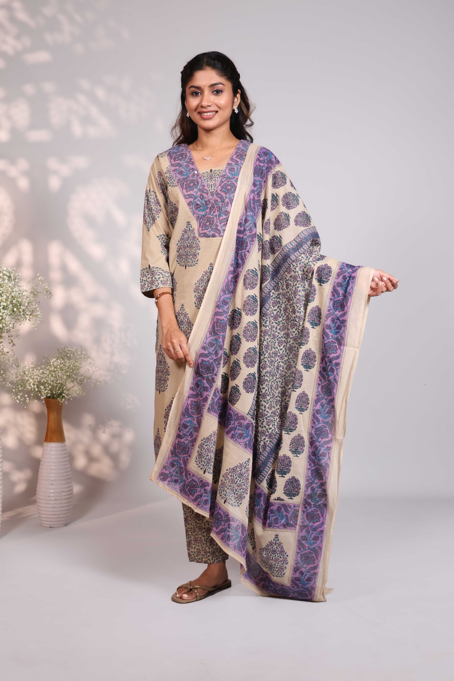 Pale brown floral design motifs V neck salwar set with 3/4th sleeve, self bottom and matching dupatta