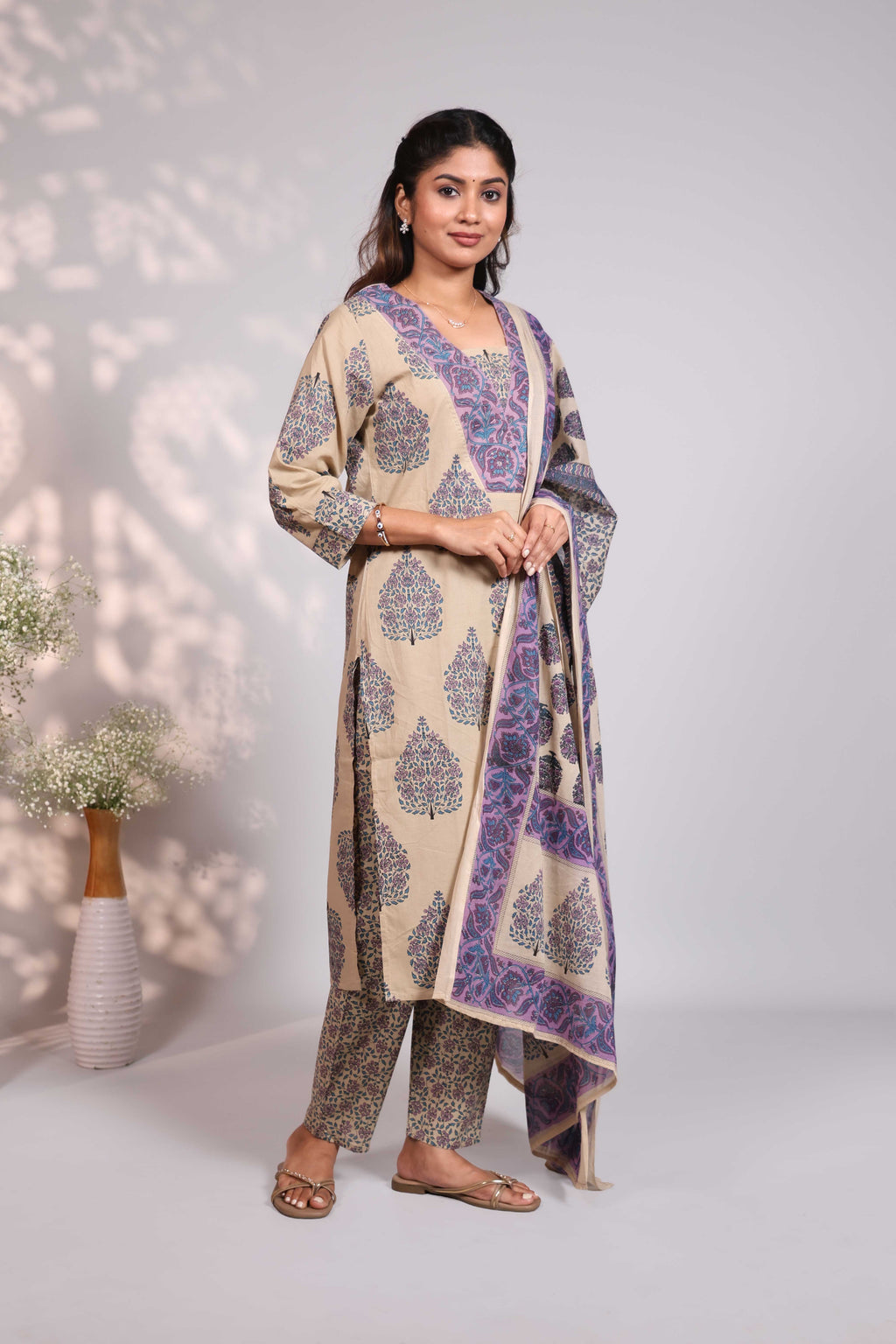 Pale brown floral design motifs V neck salwar set with 3/4th sleeve, self bottom and matching dupatta