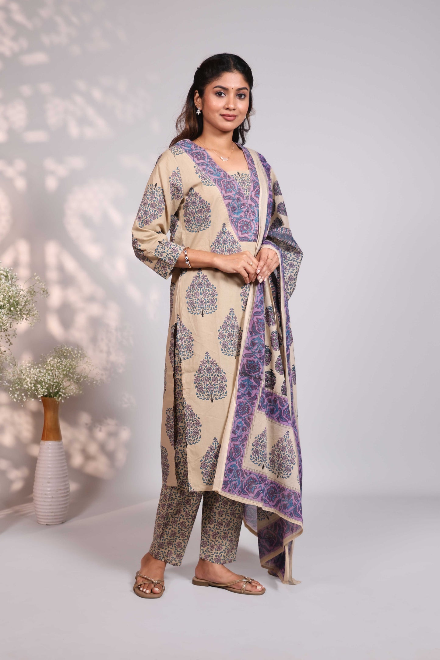 Pale brown floral design motifs V neck salwar set with 3/4th sleeve, self bottom and matching dupatta