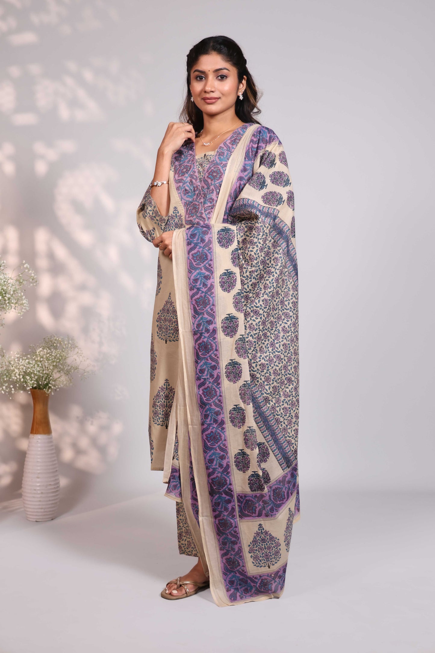 Pale brown floral design motifs V neck salwar set with 3/4th sleeve, self bottom and matching dupatta