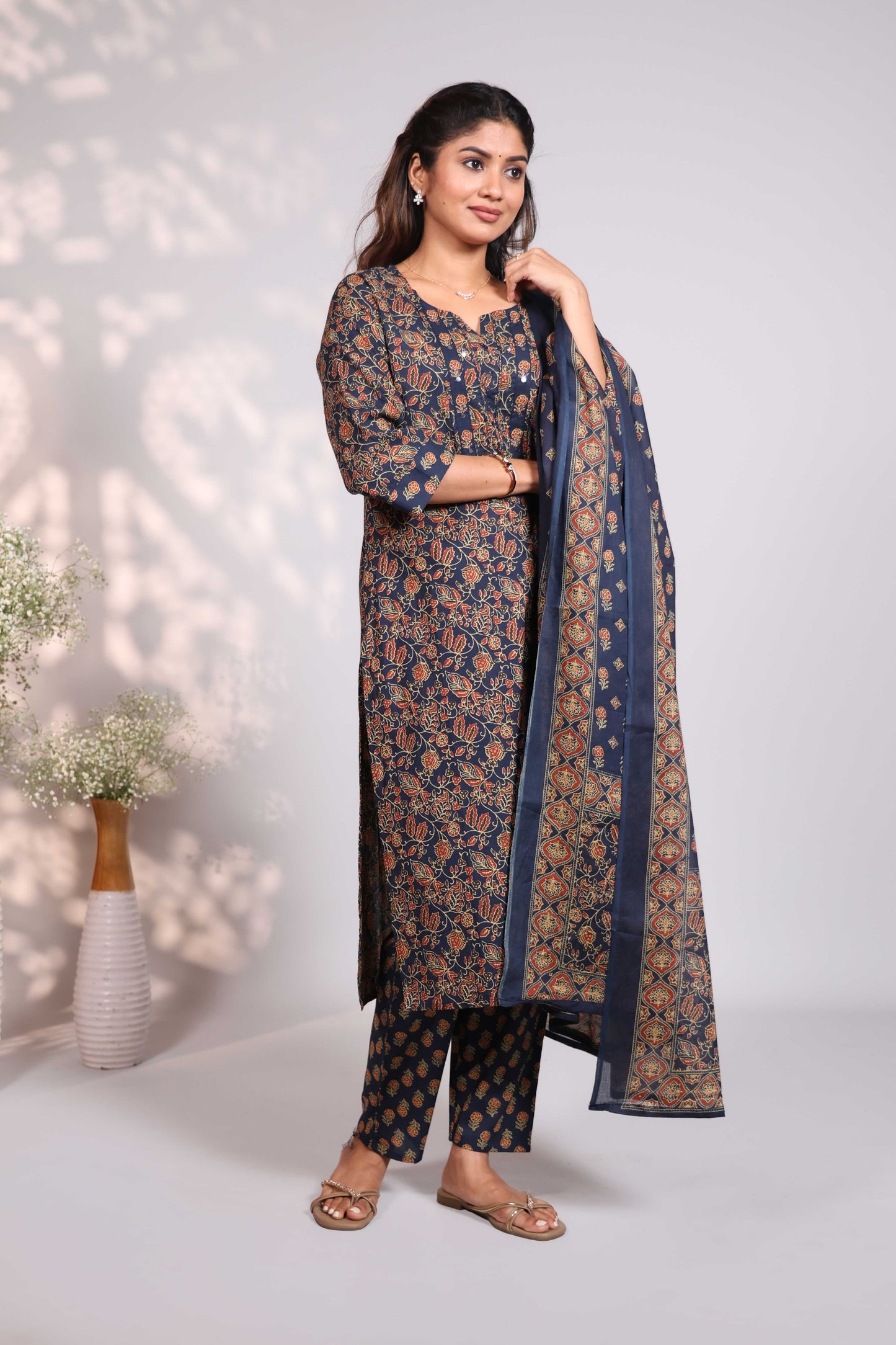 Blue floral design round neck salwar set with 3/4th sleeve, self bottom and matching dupatta