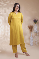 Mustard plain salwar suit with front star cut neck, 3/4 sleeves and matching bottom