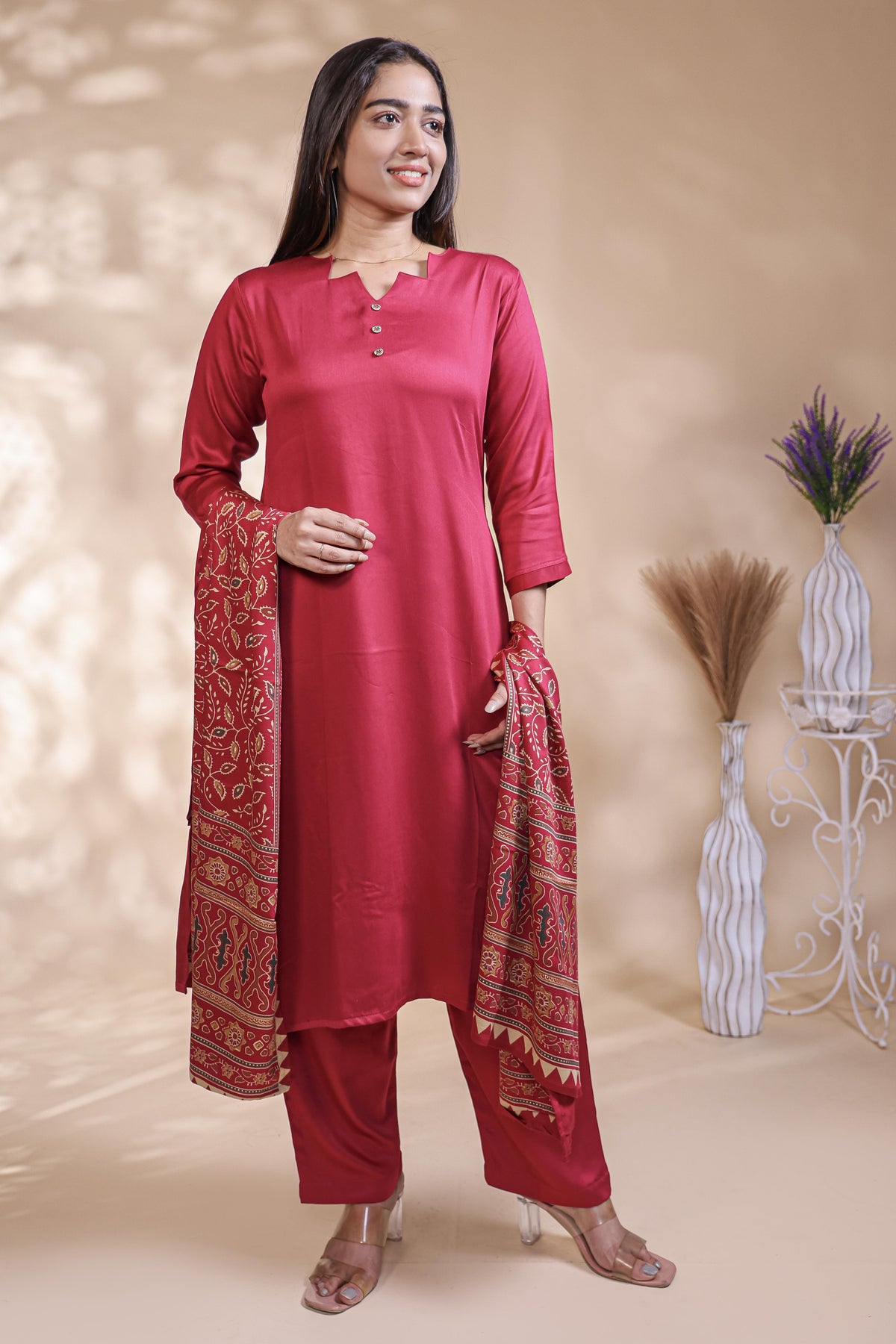 Red plain salwar suit with front star cut neck, 3/4 sleeves and matching bottom