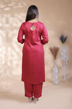 Red plain salwar suit with front star cut neck, 3/4 sleeves and matching bottom