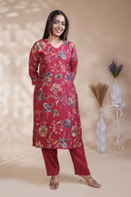 Red floral design salwar suit with front V-neck, 3/4 sleeves and matching bottom