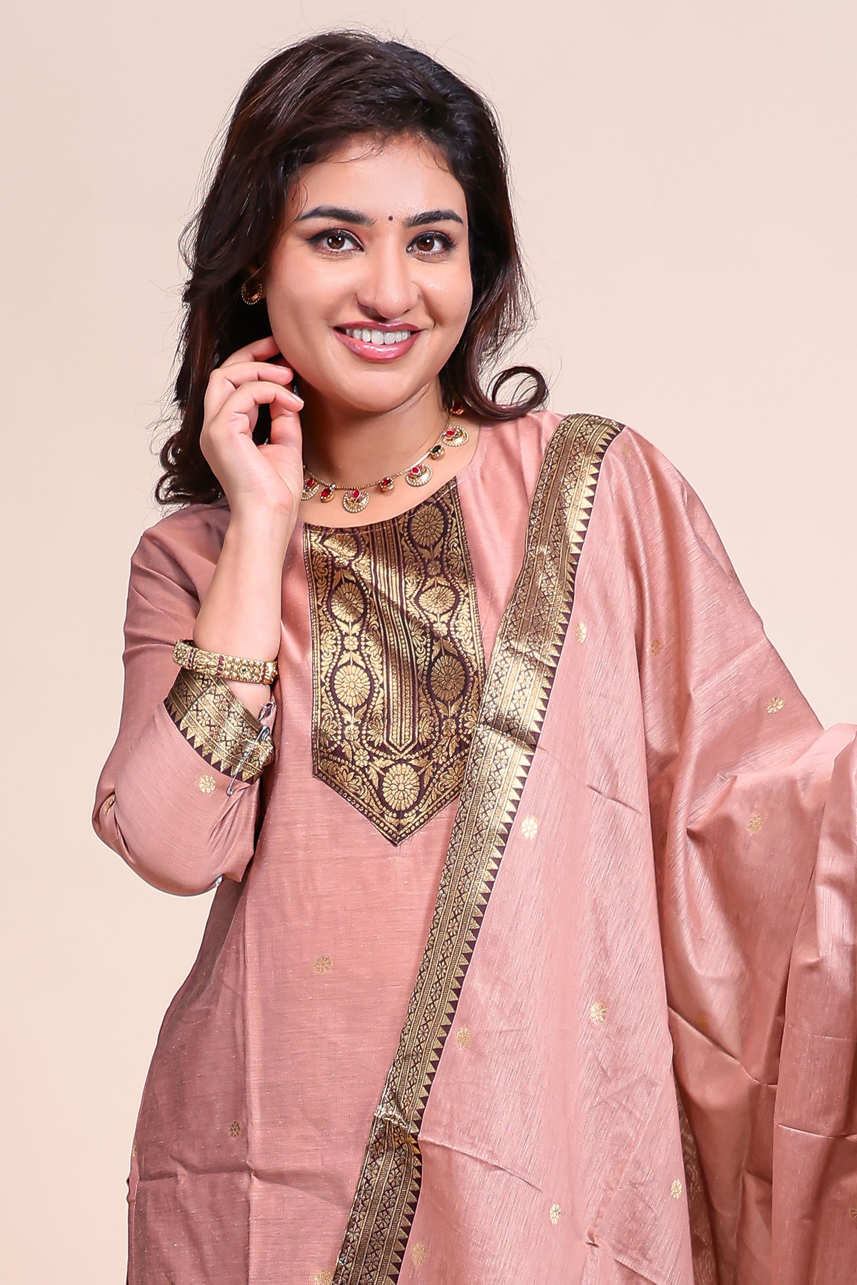 Peach traditional salwar suit with front U-neck, 3/4 sleeves and contrast bottom