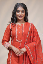 women rust orange cotton straight kurta pant and dupatta set with embroidered yoke